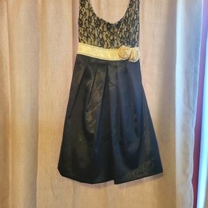 Black and cream party dress. B.Wear size 7. Lightly used.